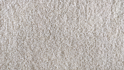 The texture of the carpet, textiles. White, Beige.