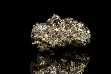 Macro mineral stone Pyrite on a black background