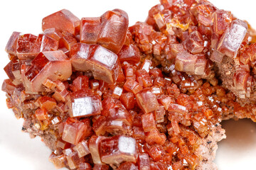 Macro mineral stone Vanadinite on a white background