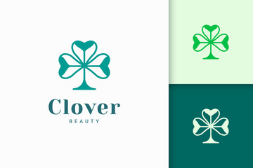 Clover logo with simple love shape represent lucky