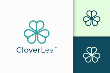 Clover logo in simple line and love shape represent lucky