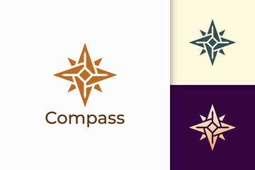 Fototapeta na wymiar Compass logo in modern shape represent adventure and survival