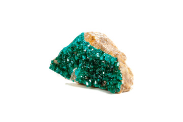 Macro mineral stone Dioptase silicate copper on a white background
