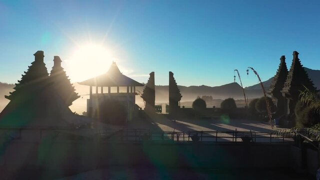 Stunning shot , aerial view of Pura Luhur Poten hindu temple near Mount Bromo volcano in East Java, Indonesia during sunrise