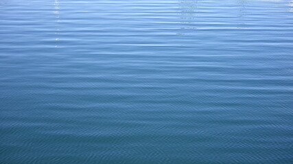 Obraz premium Close up of disturbed blue ocean water surface. Slow motion