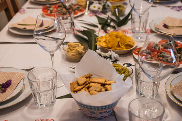 Dinner table set with some healthy snacks on it.