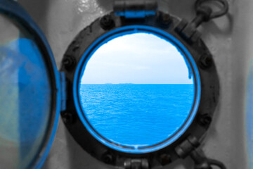 Porthole in the ferry cabin. The ferry sails on the sea