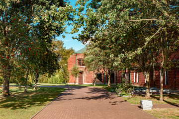 Road, rowan trees and a building in the Brest Fortress