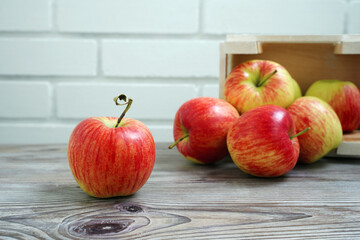 red apples on wooden table