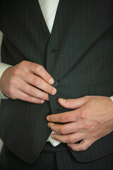 Detailed shot of businessman getting ready. High quality photo