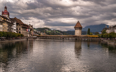 Chapel Bridge (Kapellbruecke) - covered wooden footbridge spanning the river Reuss diagonally in the in the old downtown
