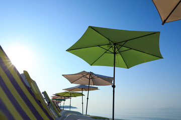 Many beach umbrellas and sunbeds at resort