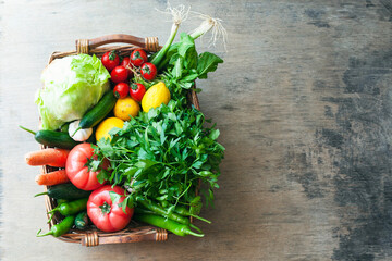 Vegetables in the basket organic vegetables on wooden background