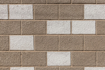 White and brown painted brick blocks pattern stone wall exterior city texture background
