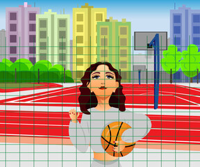 The girl is standing on the basketball court.