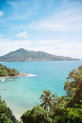 Beach with coconut trees and mountains.View of the coast of the island of island.