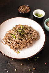 soba buckwheat noodles fresh portion meal snack on the table copy space food background rustic. top view vegan or vegetarian food