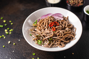 soba buckwheat noodles fresh portion meal snack on the table copy space food background rustic. top view vegan or vegetarian food