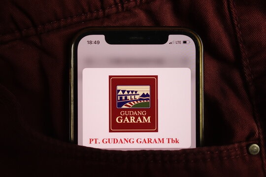 KONSKIE, POLAND - August 17, 2021: PT Gudang Garam Tbk logo displayed on mobile phone hidden in jeans pocket