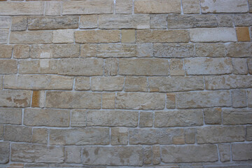 Vintage style design with natural light vintage cream beige yellow-brown textured brick wall background