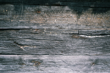 The surface of an old wooden slab house. Old slab texture. Close up brown Wooden planks texture...