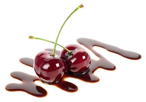 Two ripe cherries in liquid chocolate isolated on a white background. Fondue cherries.