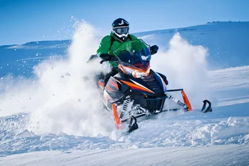 Poster Snowmobile riding with fun in deep snow powder during backcountry tour. Extreme sport adventure, outdoor activity during winter holiday on ski mountain resort © Level
