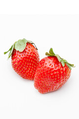  vertical format  two strawberry on white background