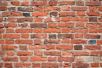 Brick old wall of dark red color. Horizontal vintage background. Exterior.