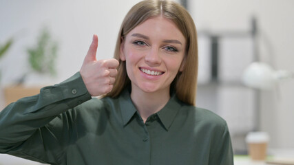 Young Woman showing Thumbs Up Sign 