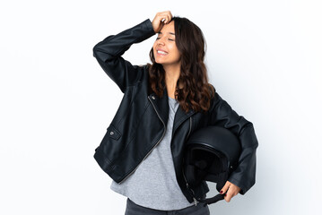 Young woman holding a motorcycle helmet over isolated white background smiling a lot