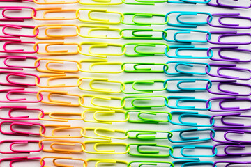 Rows of linked rainbow paper clips in full frame