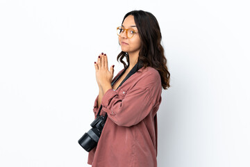 Young photographer woman over isolated white background scheming something