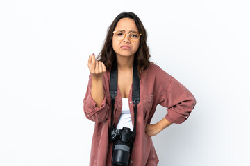 Young photographer woman over isolated white background making Italian gesture