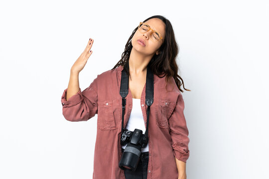 Young photographer woman over isolated white background with tired and sick expression