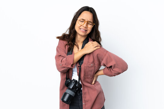 Young photographer woman over isolated white background suffering from pain in shoulder for having made an effort