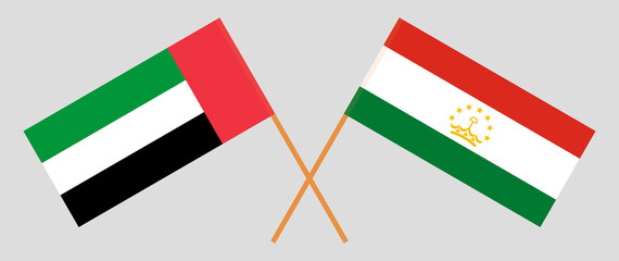 Crossed flags of the United Arab Emirates and Tajikistan. Official colors. Correct proportion