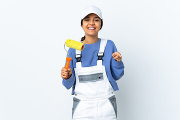 Painter woman over isolated white background surprised and pointing front