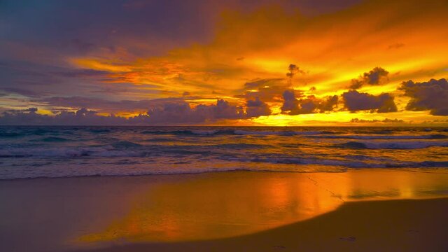 Nature video sunset The scenery, beaches, natural beauty and wonders.  sunset in the sea  On a beautiful day, the sky is golden yellow  and the sea waves wash on the beautiful soft sandy beach