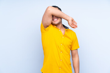 Asian handsome man over isolated background covering eyes by hands