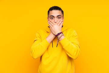 Obraz premium Asian handsome man isolated on yellow background in back position