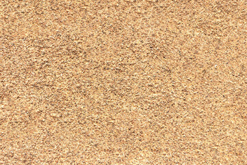 The mottled surface of the granite slab is finely speckled. Uniform texture of natural stone.