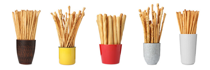 Set with delicious crispy grissini sticks on white background. Banner design