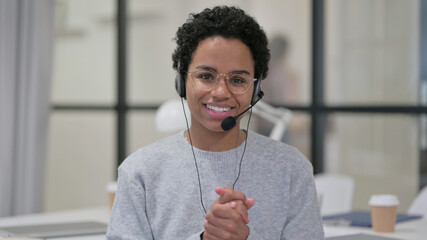 African Woman Talking through Headset with Mic 