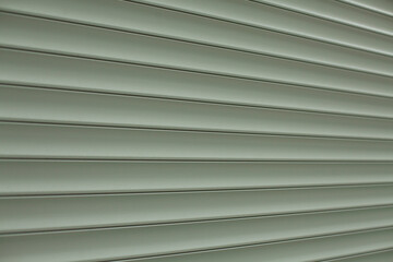 Blinds texture on the street. Plastic surface covering the windows.