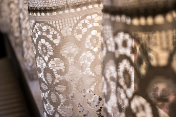 Close up of old detailed window lace curtains