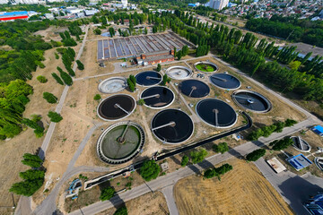 Sewage treatment plant. Sedimentation round tank or clarifier in modern sewage or wastewater...