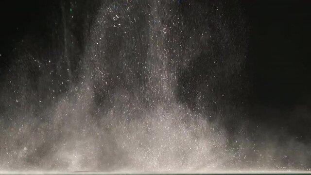 The explosive wave of shimmering particles. slow motion