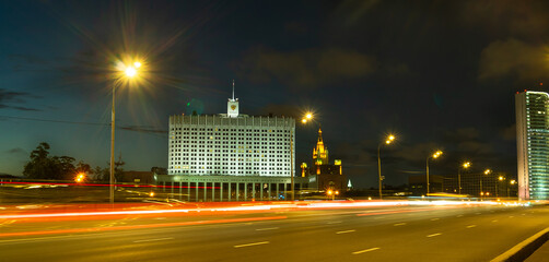 Moscow night road and bridges landscape with big white building