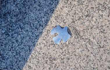 Silver wedding dove figure laying on the concrete